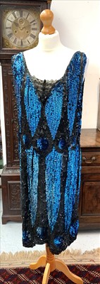 Lot 3017 - A 1920s black and petrol blue sequined flapper...