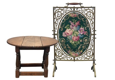 Lot 907 - An ornate late Victorian brass firescreen.