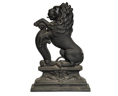 Lot 105 - A cast iron lion doorstop.