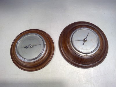 Lot 68 - Two Oak Barometers. The Barometers are 18cm...