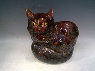 Lot 69 - A Glazed Cat Figure. The Cat is 21cm tall, the...