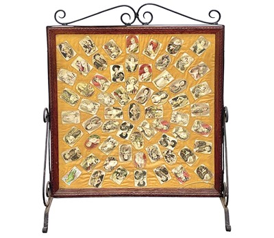 Lot 329 - A fire screen with a fabric appliqued panel.