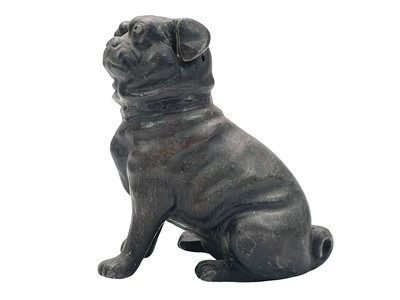 Lot 539 - A Chinese cast metal figure of a pug dog.