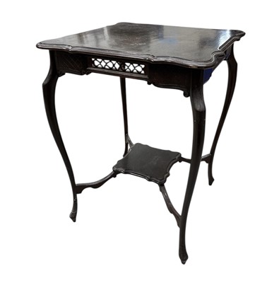 Lot 77 - An occasional table with carved detail, height...