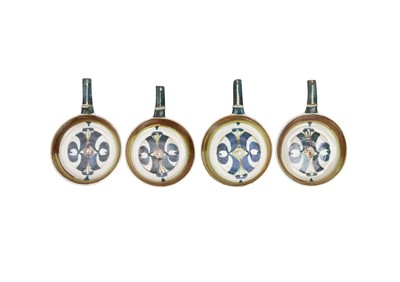 Lot 697 - Four Aldermaston pottery skillets.
