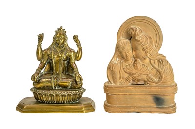 Lot 624 - A Hindu brass figure of Lakshmi.