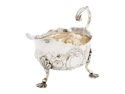 Lot 88 - A George II silver sauce boat with foliate embossed decoration.
