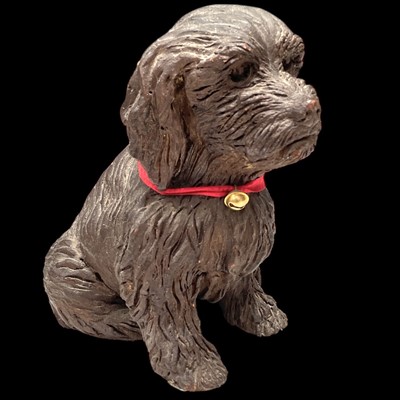 Lot 80 - A bronze effect terracotta spaniel, 22cm tall.
