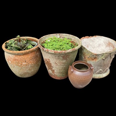 Lot 105 - Three terracotta garden pots, etc, the largest...