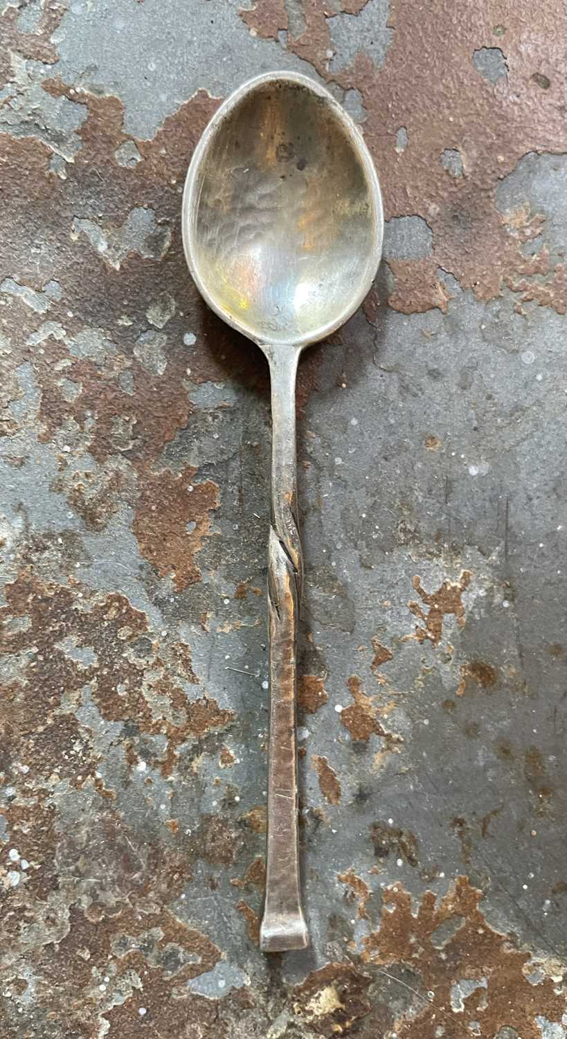 Lot 132 - Omar Ramsden, an Arts and Crafts silver preserve spoon.