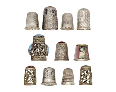 Lot 184 - A collection of eleven silver and white metal thimbles.