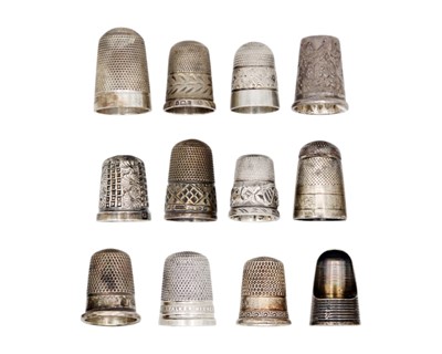 Lot 165 - A collection of twelve silver thimbles.