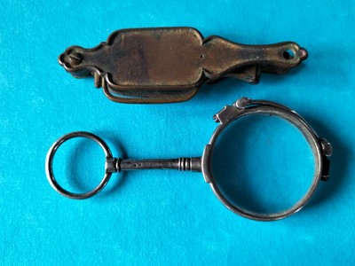 Lot 140 - A pair of white metal lorgnettes.