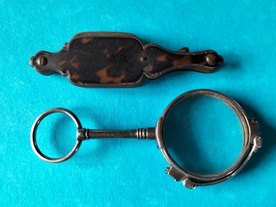Lot 140 - A pair of white metal lorgnettes.