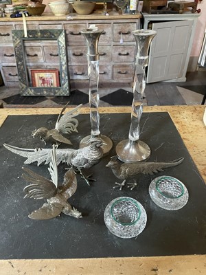 Lot 141 - A pair of silver plated pheasant table ornaments.