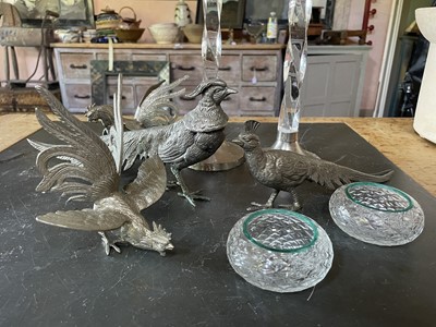 Lot 141 - A pair of silver plated pheasant table ornaments.