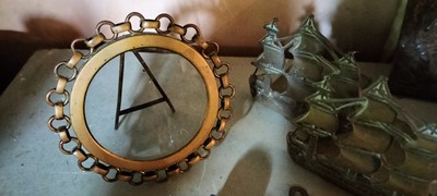 Lot 142 - A late Victorian brass circular photograph frame.