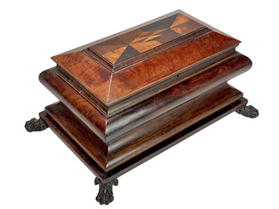 Lot 61 - A Regency exotic wood inlaid sarcophagus shape tea caddy.