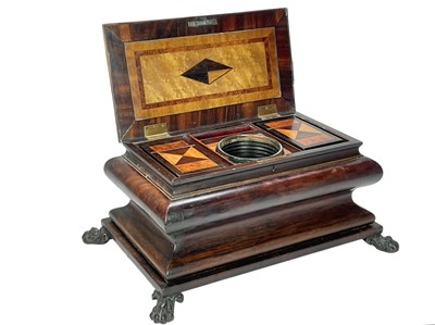 Lot 61 - A Regency exotic wood inlaid sarcophagus shape tea caddy.