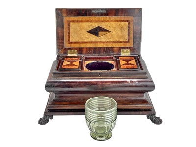 Lot 61 - A Regency exotic wood inlaid sarcophagus shape tea caddy.
