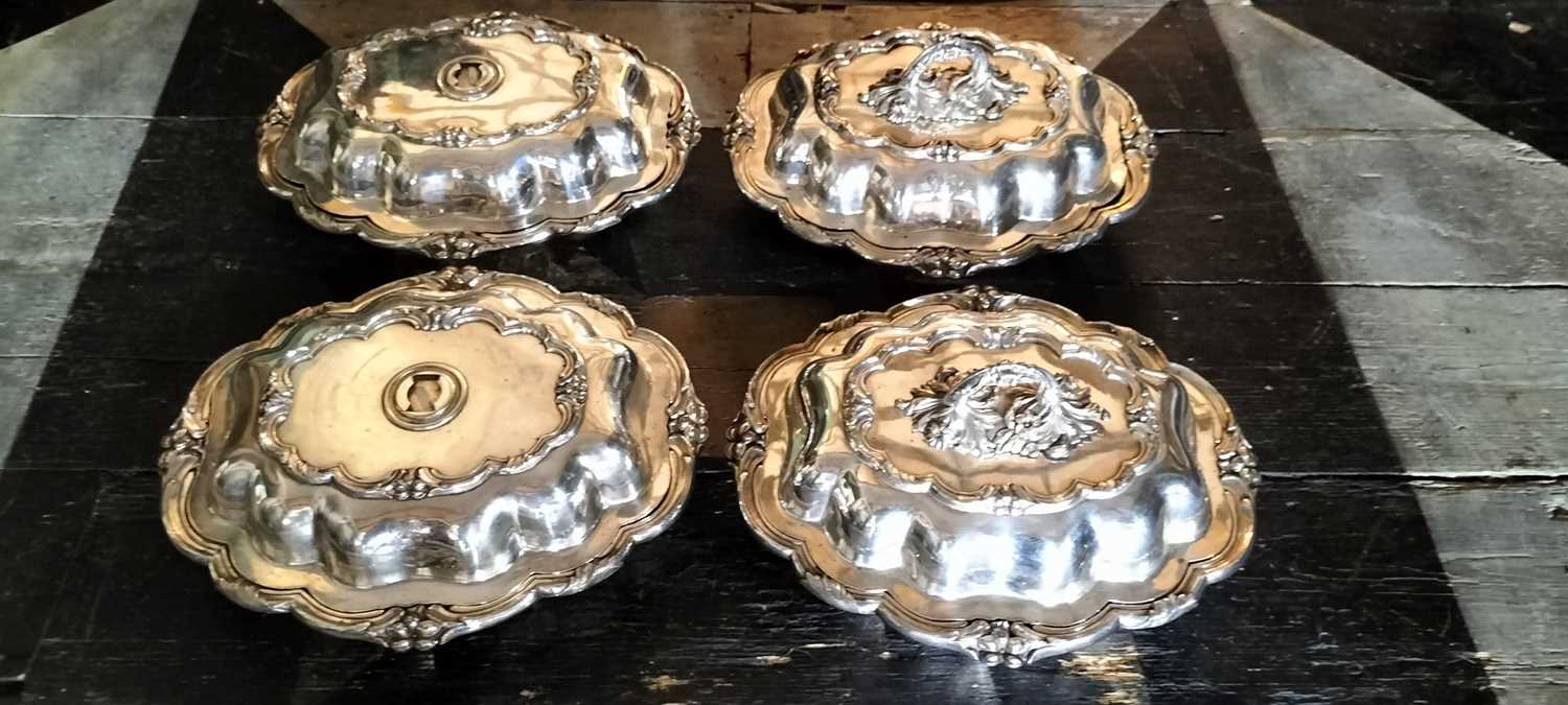 Lot 144 - A set of four Old Sheffield plate entree dishes and covers.