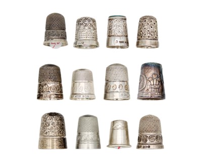 Lot 169 - A collection of twelve silver thimbles.