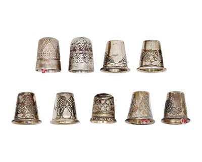Lot 185 - A collection of nine silver thimbles.