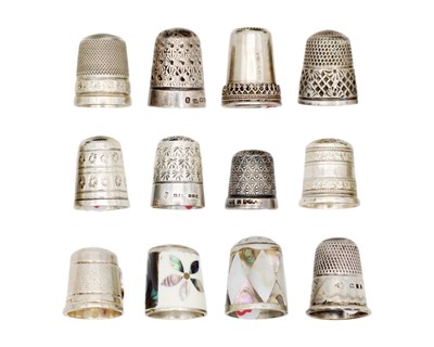 Lot 172 - A collection of twelve silver and white metal thimbles.
