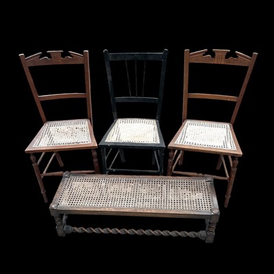 Lot 134 - Three cane-seated chairs and a long foot stool,...