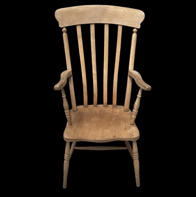 Lot 138 - A beech lathe back Windsor style chair.