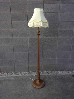 Lot 201 - An Oak Standard Lamp.