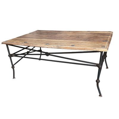 Lot 183 - A coffee table with wrought iron legs.