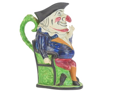 Lot 433 - A Staffordshire toby jug modelled as Mr Punch.