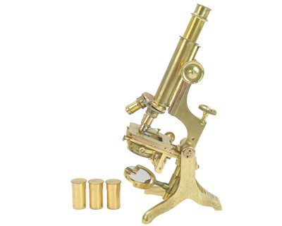 Lot 216 - A late Victorian brass compound microscope.