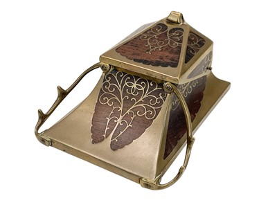 Lot 171 - An Art Nouveau/Jugendstil brass, rosewood, and inlaid inkstand.
