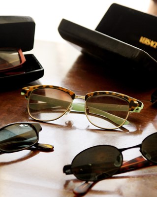 Lot 181 - An assortment of sunglasses and purses.