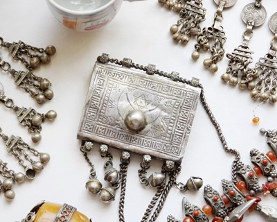 Lot 185 - A selection of six Banjara tribal necklaces with a large amber-style pendant.
