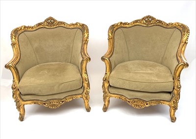 Lot 3490 - A pair of ornate gilt armchairs, early 20th...