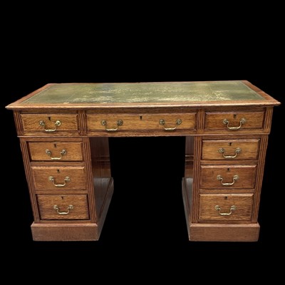 Lot 35 - A late Victorian oak twin pedestal desk, 122cm...