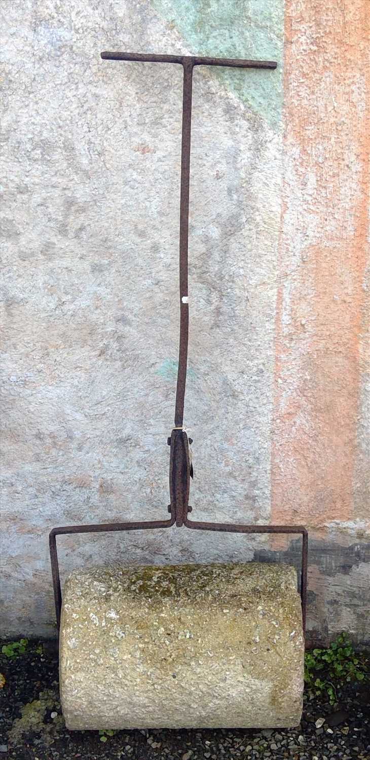 Lot 292 - A wrought iron and granite garden roller....