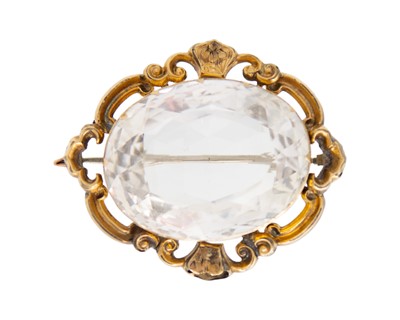 Lot 64 - A large Victorian gold and rock crystal quartz brooch.