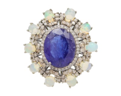 Lot 30 - A large vintage-style cocktail ring set with tanzanite, opals, and diamonds set in white metal.