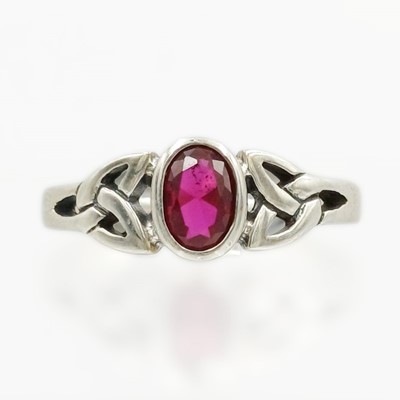 Lot 146 - A silver and CZ set Celtic-style ring.