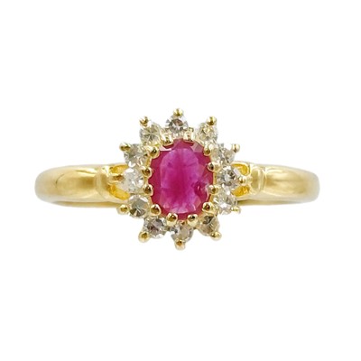 Lot 132 - A 9k gold ruby and diamond cluster ring.