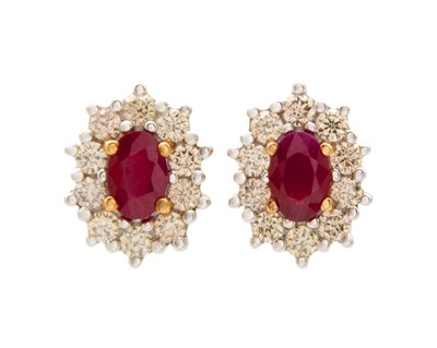 Lot 77 - A pair of 9k gold, ruby, and diamond cluster stud earrings.