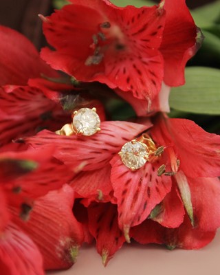 Lot 85 - A pair of 18k gold 2ct diamond solitaire stud earrings.