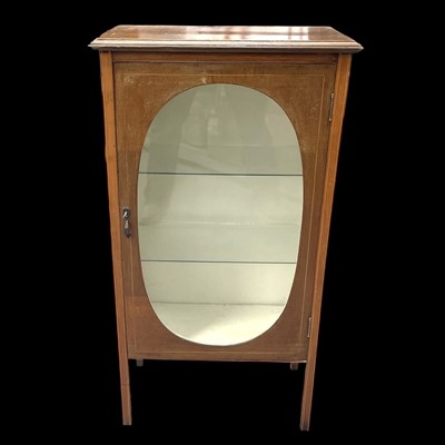 Lot 19 - An Oval Front Display Cabinet. The Cabinet is...
