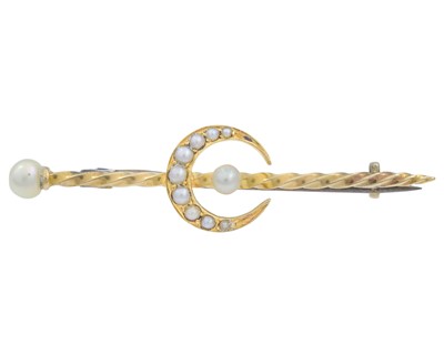 Lot 67 - A gold pearl set crescent bar brooch.