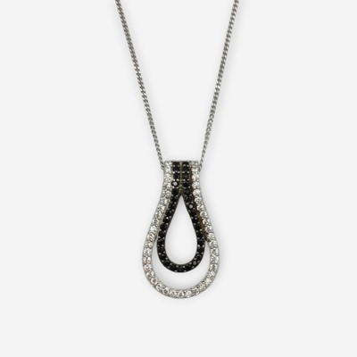 Lot 169 - A silver CZ pendant on a silver chain.