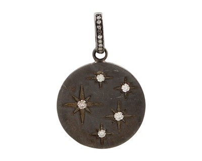 Lot 32 - A silver and diamond set disc pendant.